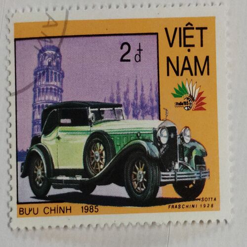VIETNAM - CIRCA 1985: A stamp printed in Vietnam shows a car Isotta Fraschini 1928 and Leaning Tower of Pisa, series