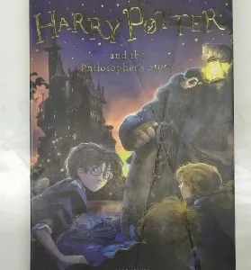 Harry Potter book, Philosopher's Stone paperback, J.K. Rowling novel, Bloomsbury paperback, young wizard story, fantasy fiction, Hogwarts adventures, magical fiction book, best fantasy novel, classic children’s book, English language book, magic adventure, wizard school book, first Harry Potter, international bestseller, wizarding adventure, fantasy paperback, Rowling debut, modern classic book, Potter series, magic story, collectible fiction, award winning novel, popular fantasy, classic paperback, British bestseller, coming of age, magic novel, paperback edition, middle grade book, Potter paperback, Hogwarts magic, youth classic, fantasy adventure, English fiction classic, bestseller book, magical series, fantasy saga, Bloomsbury edition, Harry Potter collectible, fiction for kids, popular book, must read novel, modern fantasy, children's adventure, Potter collectible, British literature, Hogwarts story, famous novel, children's favorite, modern classic, Rowling's masterpiece, literary bestseller, collectible paperback, children’s literature, educational fiction, read aloud book, beloved book, debut fiction, new world fantasy, adventure in magic, school life novel, British fantasy, legendary book, Sorcerer's Stone edition, Hogwarts series, top book fantasy, famous Harry Potter, Rowling book series, magic beginner book, globally popular, iconic fantasy, Harry Potter fiction, English classic book, Potter debut, magical journey, first magic book, wizard stories, top rated book, spellbinding adventure, fiction hit, ultimate fantasy
