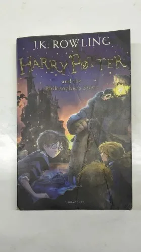 Harry Potter book, Philosopher's Stone paperback, J.K. Rowling novel, Bloomsbury paperback, young wizard story, fantasy fiction, Hogwarts adventures, magical fiction book, best fantasy novel, classic children’s book, English language book, magic adventure, wizard school book, first Harry Potter, international bestseller, wizarding adventure, fantasy paperback, Rowling debut, modern classic book, Potter series, magic story, collectible fiction, award winning novel, popular fantasy, classic paperback, British bestseller, coming of age, magic novel, paperback edition, middle grade book, Potter paperback, Hogwarts magic, youth classic, fantasy adventure, English fiction classic, bestseller book, magical series, fantasy saga, Bloomsbury edition, Harry Potter collectible, fiction for kids, popular book, must read novel, modern fantasy, children's adventure, Potter collectible, British literature, Hogwarts story, famous novel, children's favorite, modern classic, Rowling's masterpiece, literary bestseller, collectible paperback, children’s literature, educational fiction, read aloud book, beloved book, debut fiction, new world fantasy, adventure in magic, school life novel, British fantasy, legendary book, Sorcerer's Stone edition, Hogwarts series, top book fantasy, famous Harry Potter, Rowling book series, magic beginner book, globally popular, iconic fantasy, Harry Potter fiction, English classic book, Potter debut, magical journey, first magic book, wizard stories, top rated book, spellbinding adventure, fiction hit, ultimate fantasy